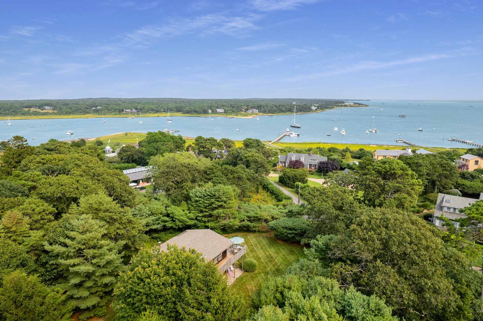 25 Down Harbor Road Edgartown, MA 02539 - Photo 1 of 35 a view of a lake with houses in the back