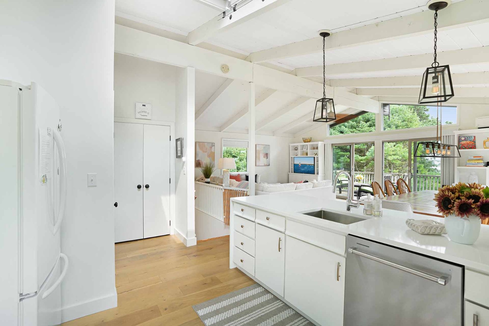 25 Down Harbor Road Edgartown, MA 02539 - Photo 13 of 35 a view of a kitchen with a sink a window and stainless steel appliances