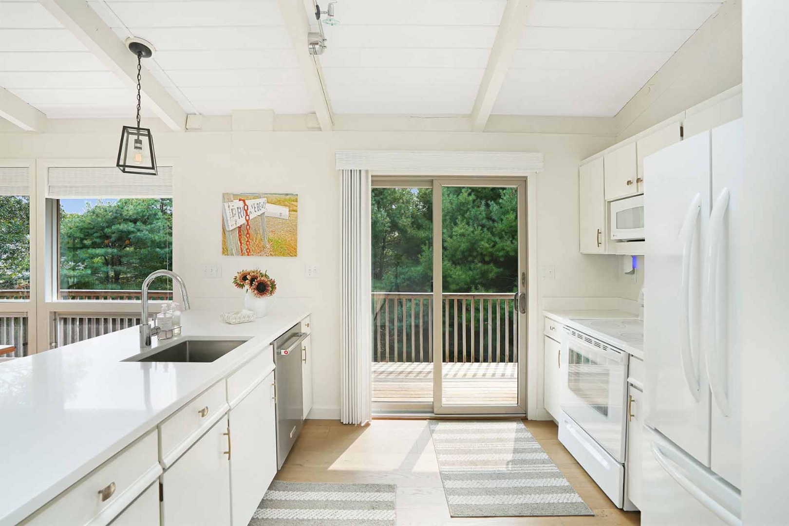 25 Down Harbor Road Edgartown, MA 02539 - Photo 17 of 35 a view of a kitchen with a sink and windows