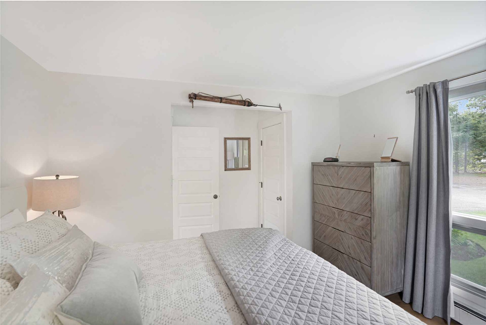 25 Down Harbor Road Edgartown, MA 02539 - Photo 28 of 35 a room with a bed and cabinets