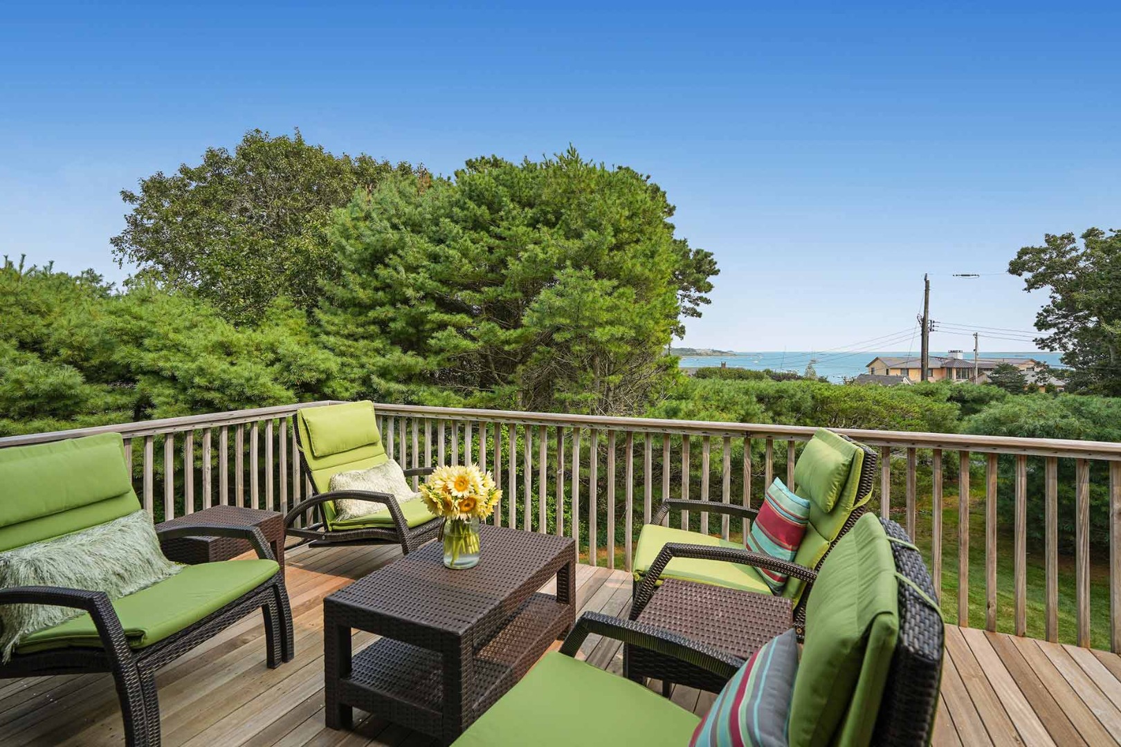 25 Down Harbor Road Edgartown, MA 02539 - Photo 10 of 35 a balcony with wooden floor outdoor seating and yard in the back