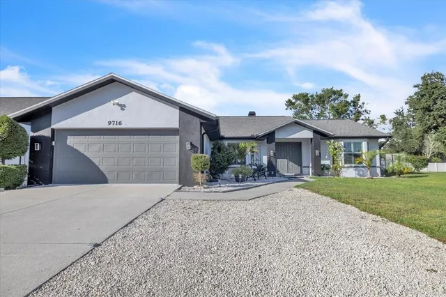 a kitchen with a sink cabinets and window
