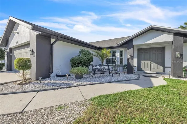 a kitchen with stainless steel appliances a refrigerator sink and white cabinets