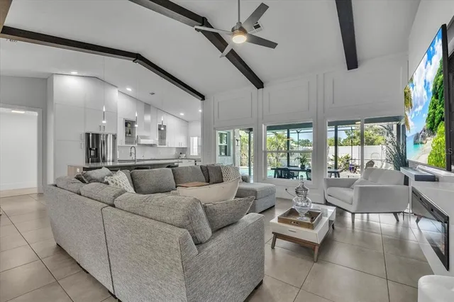 a bedroom with a bed and a potted plant