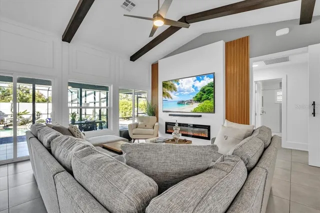 a dining room with furniture and a window