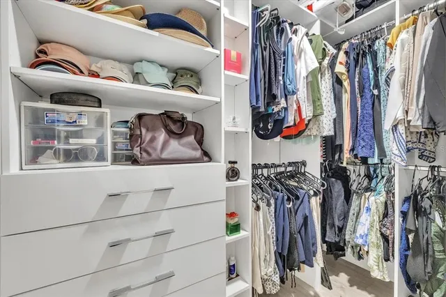 a bathroom with a double vanity sink toilet and shower