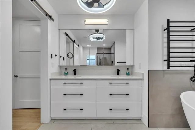 a bedroom with double bed and a couch