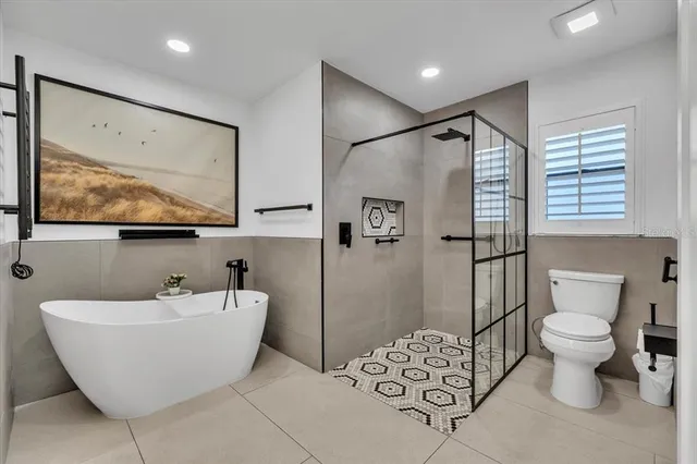 a view of a living room with washer and dryer