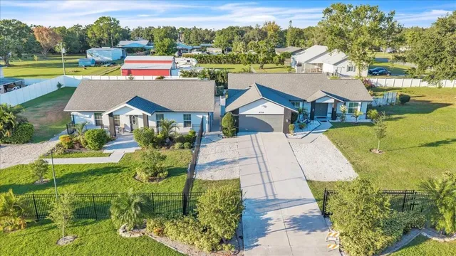 a living room with furniture and a view of kitchen