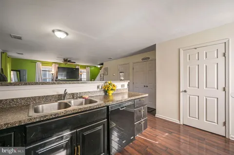 a kitchen that has a sink and a stove