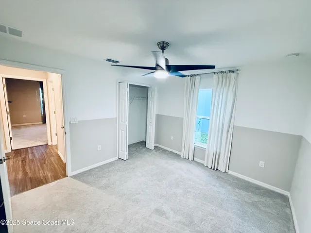 a view of a room with an empty space