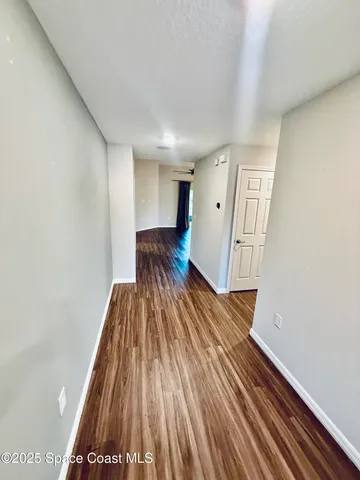 a view of wooden floor in an empty room