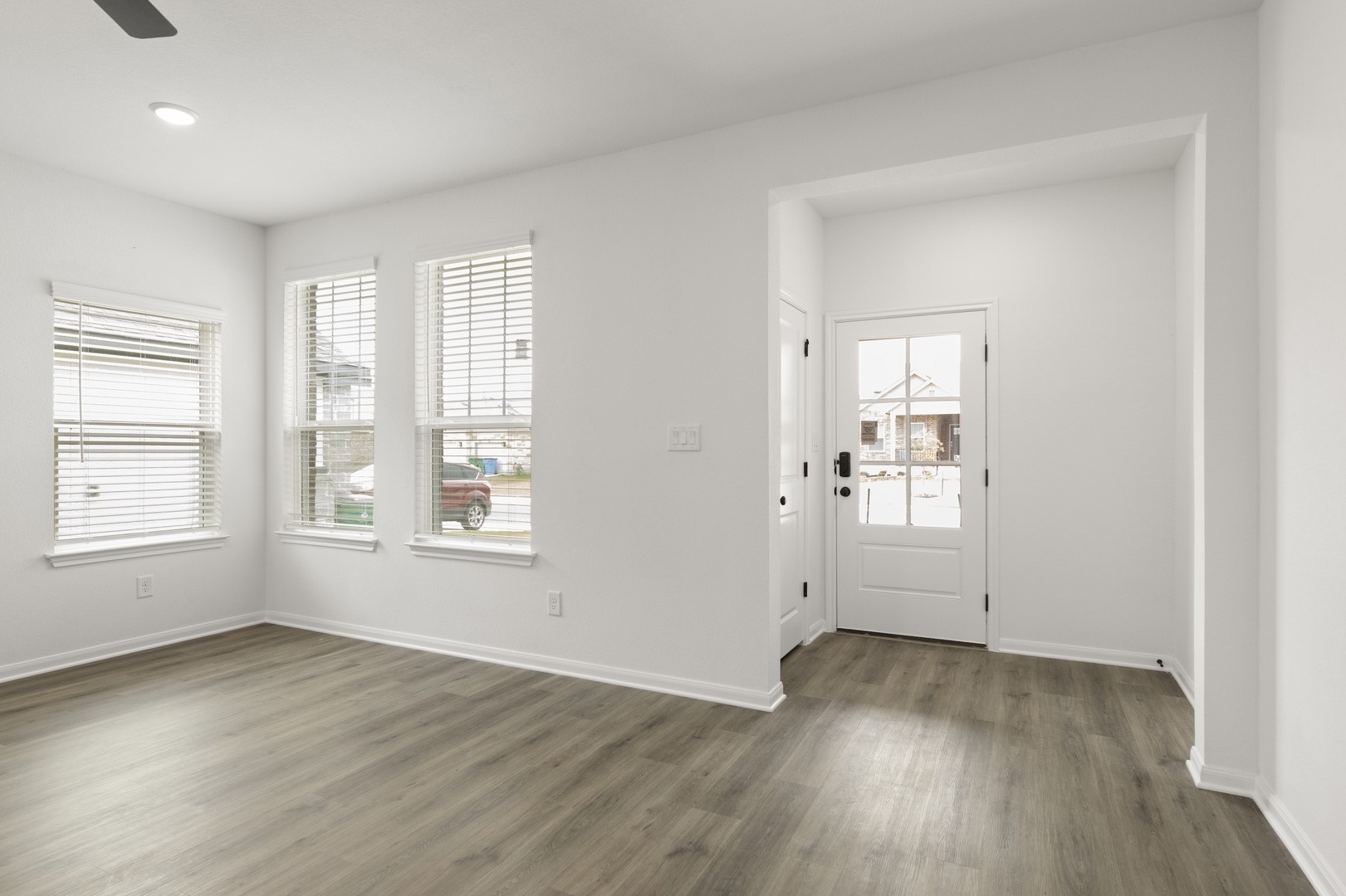 3717 Pin Oak Hills Seguin, TX 78155 - Photo 7 of 22 an empty room with wooden floor and windows