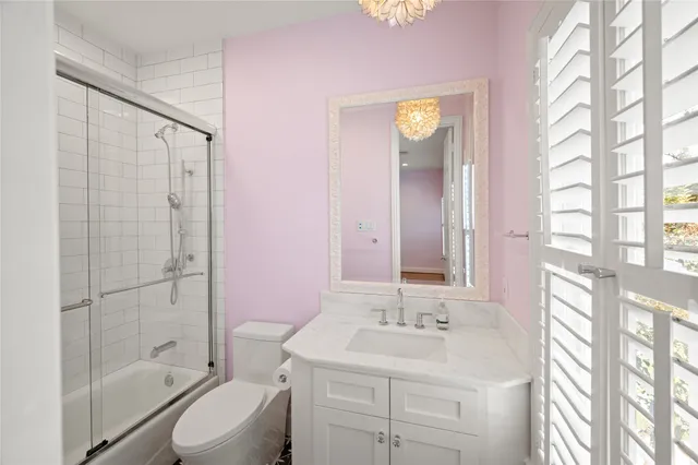 a bathroom with a sink toilet tub and shower