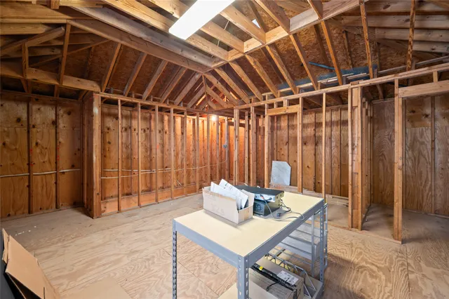 a view of a patio with couches and a fireplace