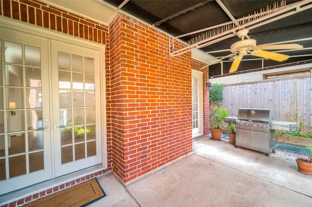 a view of a back yard of the house with a garden
