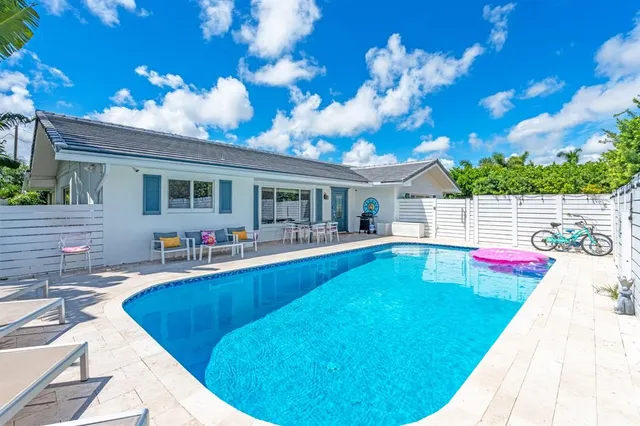 a view of a house with swimming pool