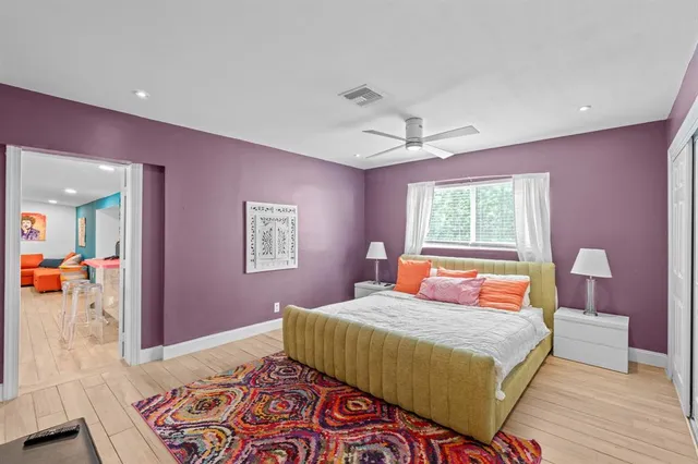 a bathroom with a bath tub a sink and a curtain