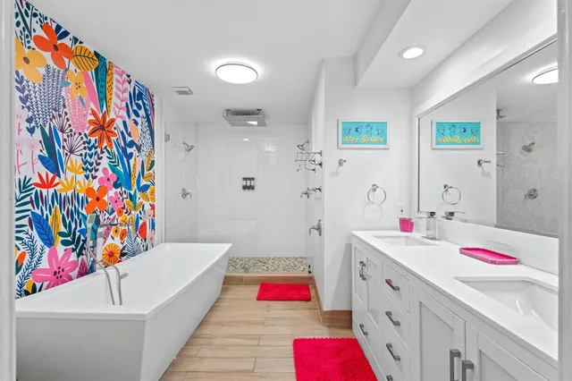 a bathroom with a sink mirror and vanity