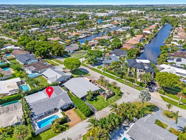 an aerial view of residential houses with outdoor space