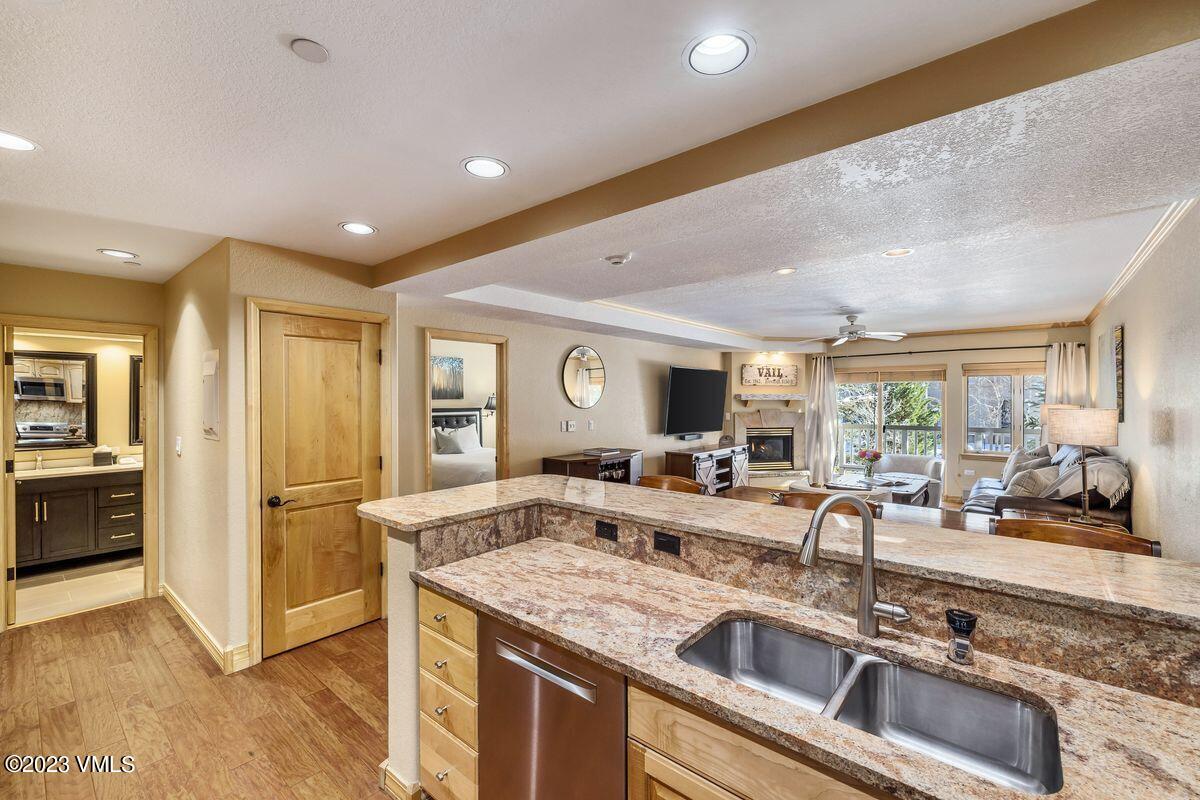 210 Offerson Road, Unit R225 Beaver Creek, CO 81620 - Photo 11 of 42 a kitchen with granite countertop a sink and counter space