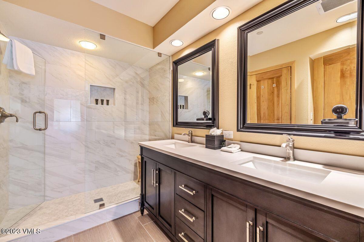210 Offerson Road, Unit R225 Beaver Creek, CO 81620 - Photo 18 of 42 a bathroom with a double vanity sink and a mirror