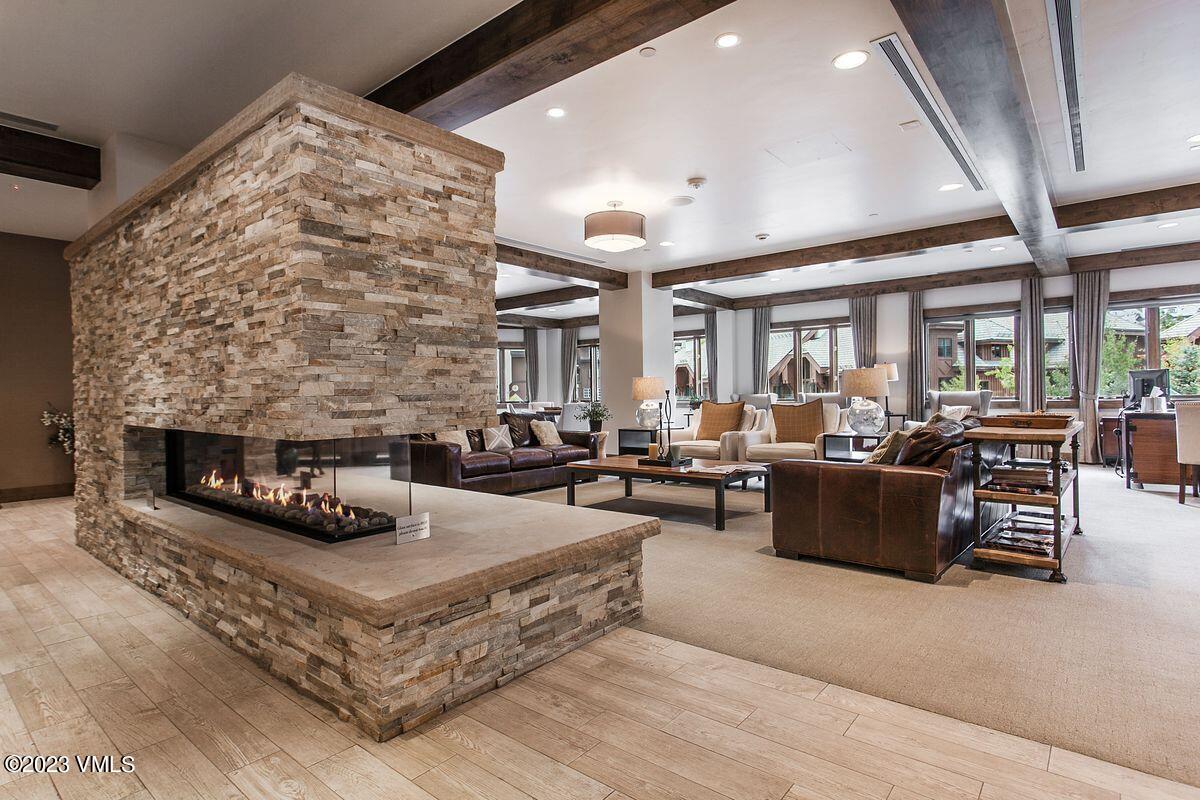 210 Offerson Road, Unit R225 Beaver Creek, CO 81620 - Photo 25 of 42 a living room with furniture and a fireplace