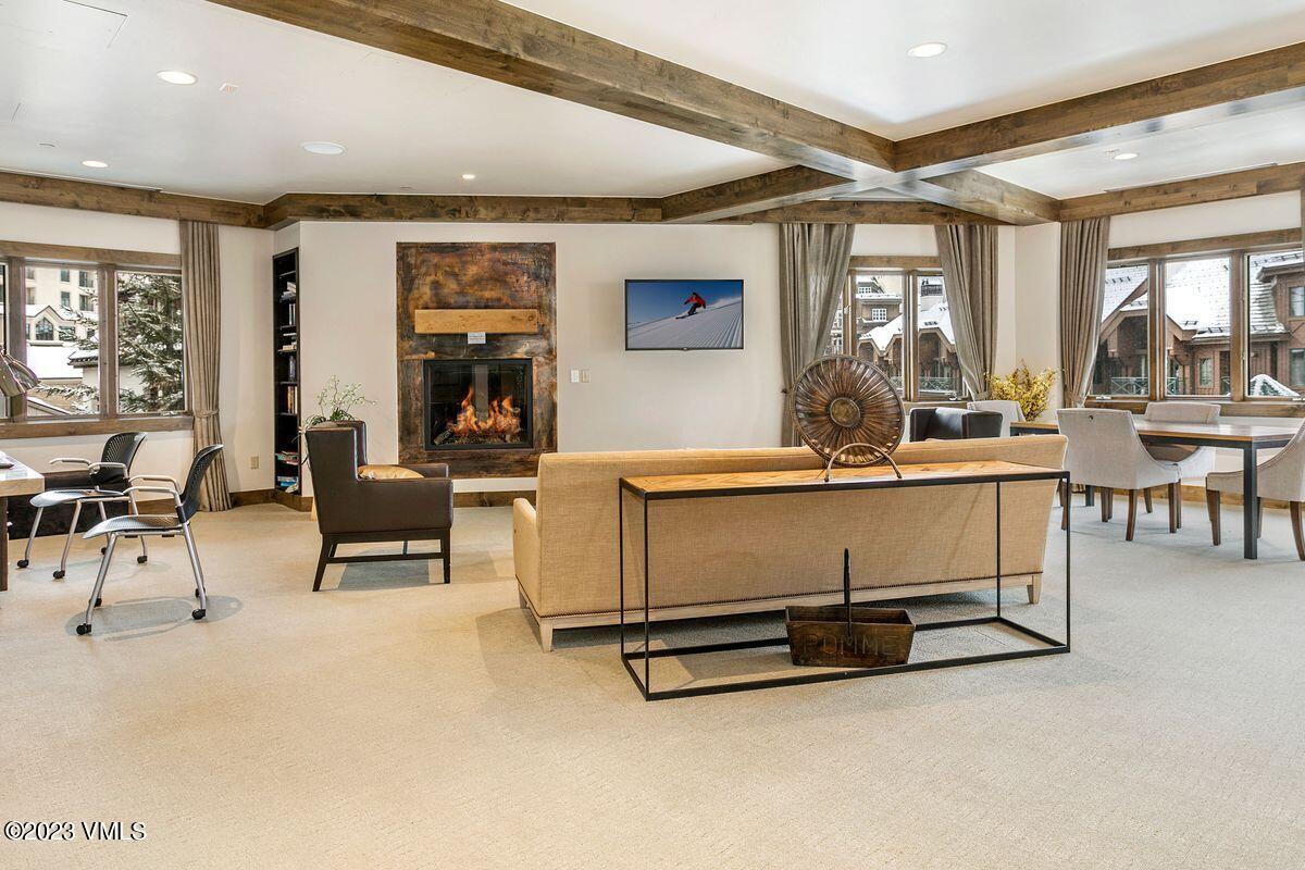 210 Offerson Road, Unit R225 Beaver Creek, CO 81620 - Photo 27 of 42 a living room with furniture gym equipment and a large window