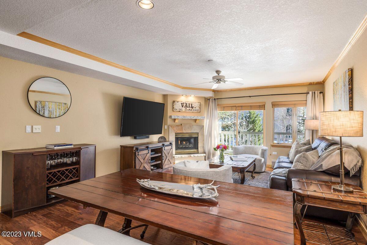 210 Offerson Road, Unit R225 Beaver Creek, CO 81620 - Photo 3 of 42 a living room with furniture a flat screen tv and a large window