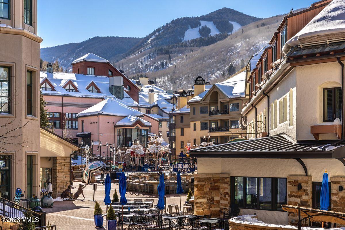 210 Offerson Road, Unit R225 Beaver Creek, CO 81620 - Photo 34 of 42 a view of a building with a lot of cars parked in front of it