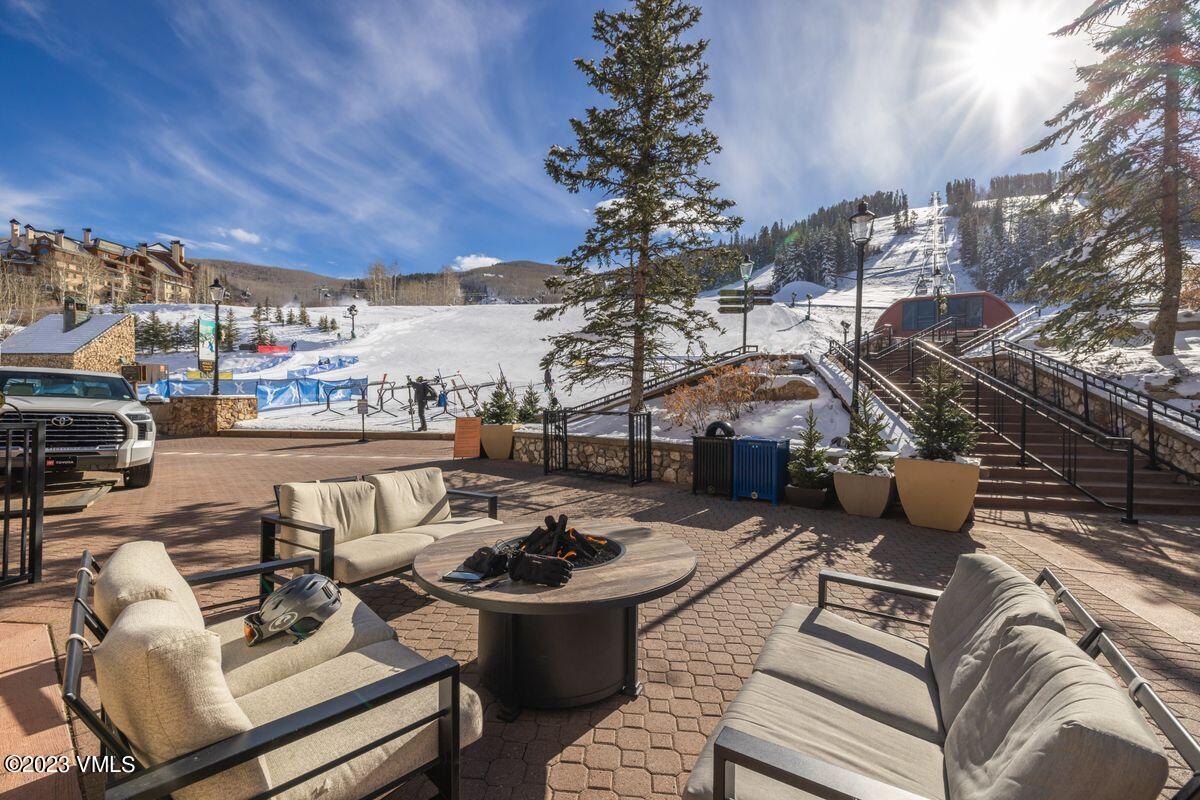 210 Offerson Road, Unit R225 Beaver Creek, CO 81620 - Photo 38 of 42 a view of a patio with couches table and chairs and potted plants