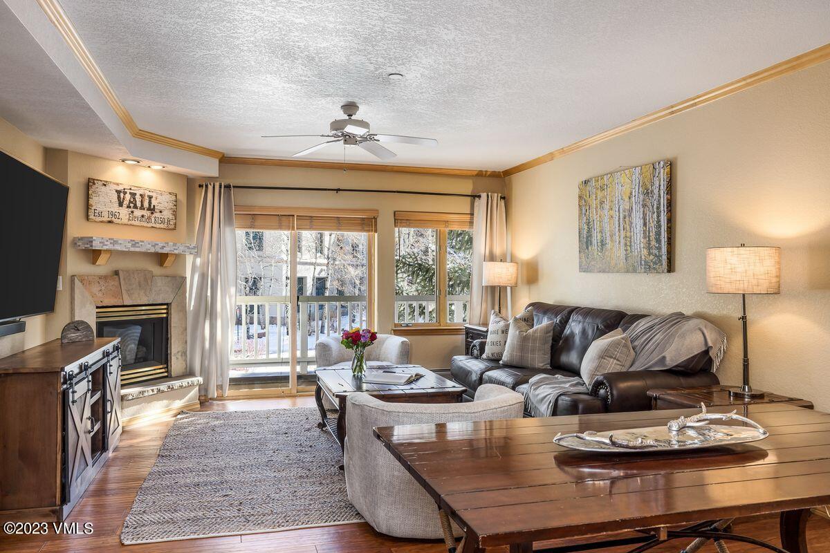 210 Offerson Road, Unit R225 Beaver Creek, CO 81620 - Photo 4 of 42 a living room with fireplace furniture and a flat screen tv