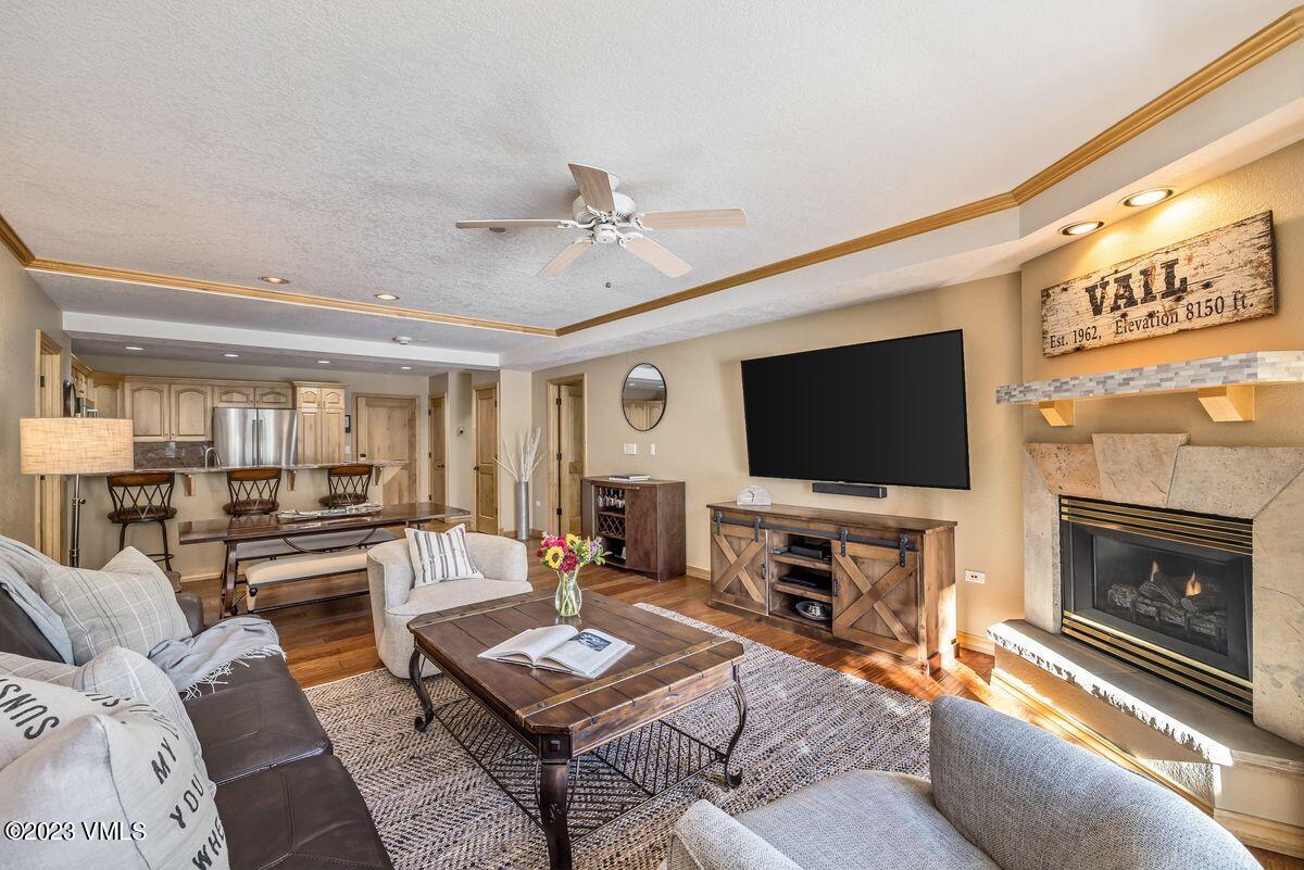 210 Offerson Road, Unit R225 Beaver Creek, CO 81620 - Photo 6 of 42 a living room with furniture a flat screen tv and a fireplace