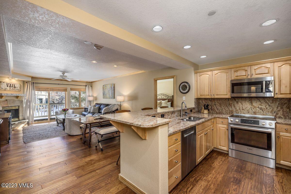 210 Offerson Road, Unit R225 Beaver Creek, CO 81620 - Photo 8 of 42 a kitchen with a stove and cabinets