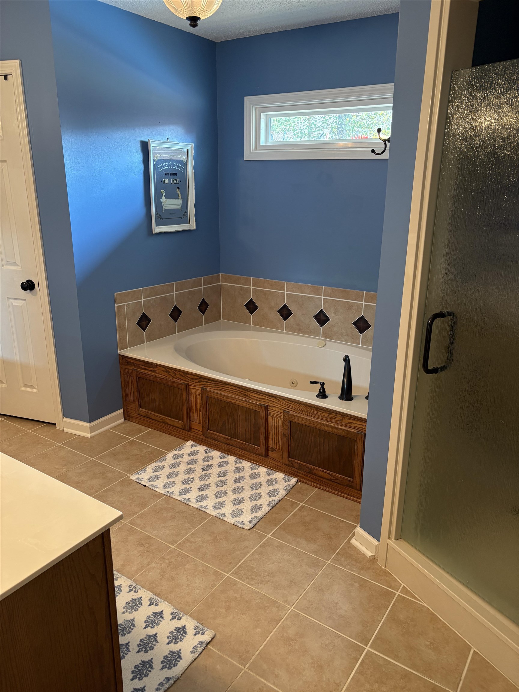 488 Old Collierville Arlington Road Collierville, TN 38017 - Photo 17 of 23 a bathroom with a bathtub and a shower