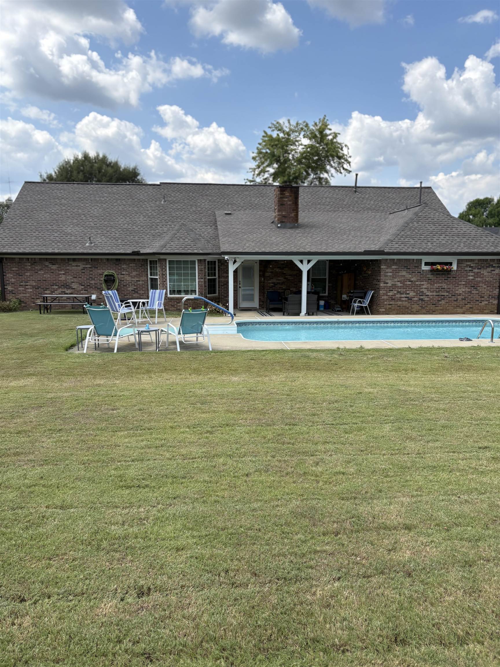 488 Old Collierville Arlington Road Collierville, TN 38017 - Photo 19 of 23 a view of a house with pool and chairs
