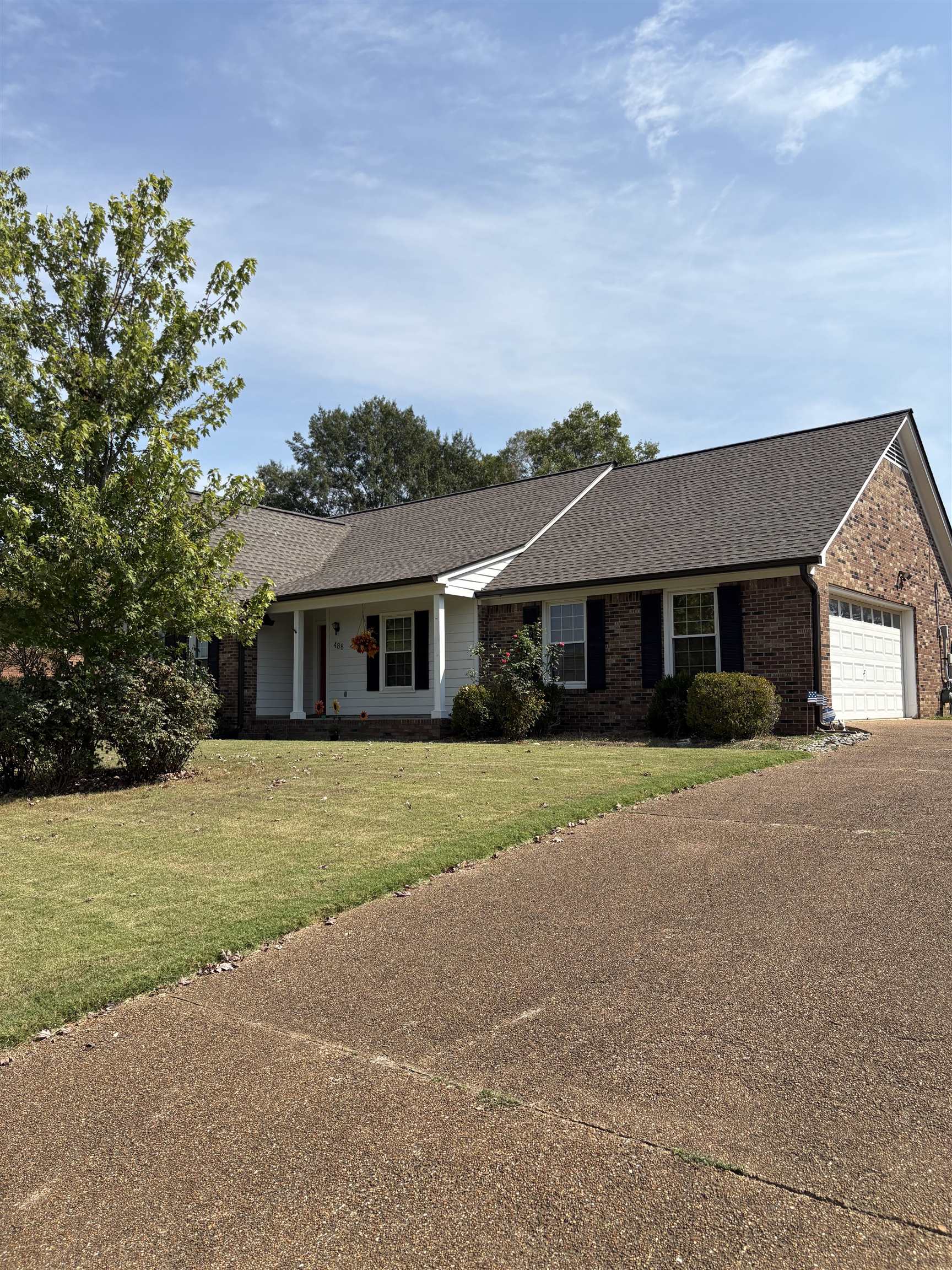 488 Old Collierville Arlington Road Collierville, TN 38017 - Photo 2 of 23 a front view of a house with a garden