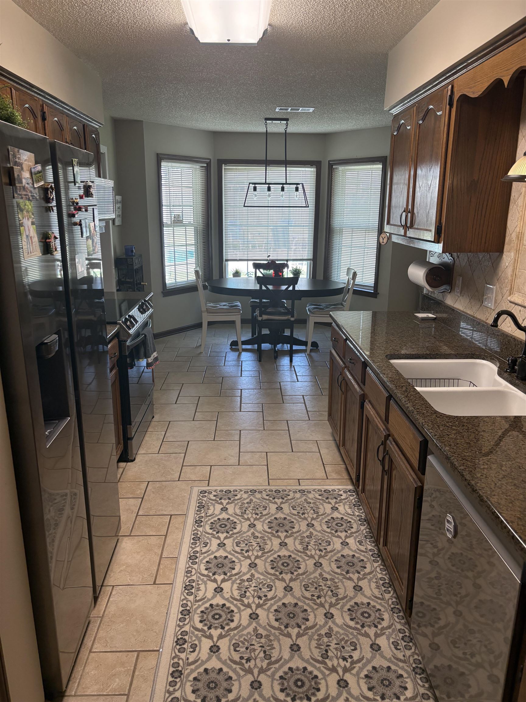 488 Old Collierville Arlington Road Collierville, TN 38017 - Photo 9 of 23 a kitchen with a sink stove and refrigerator