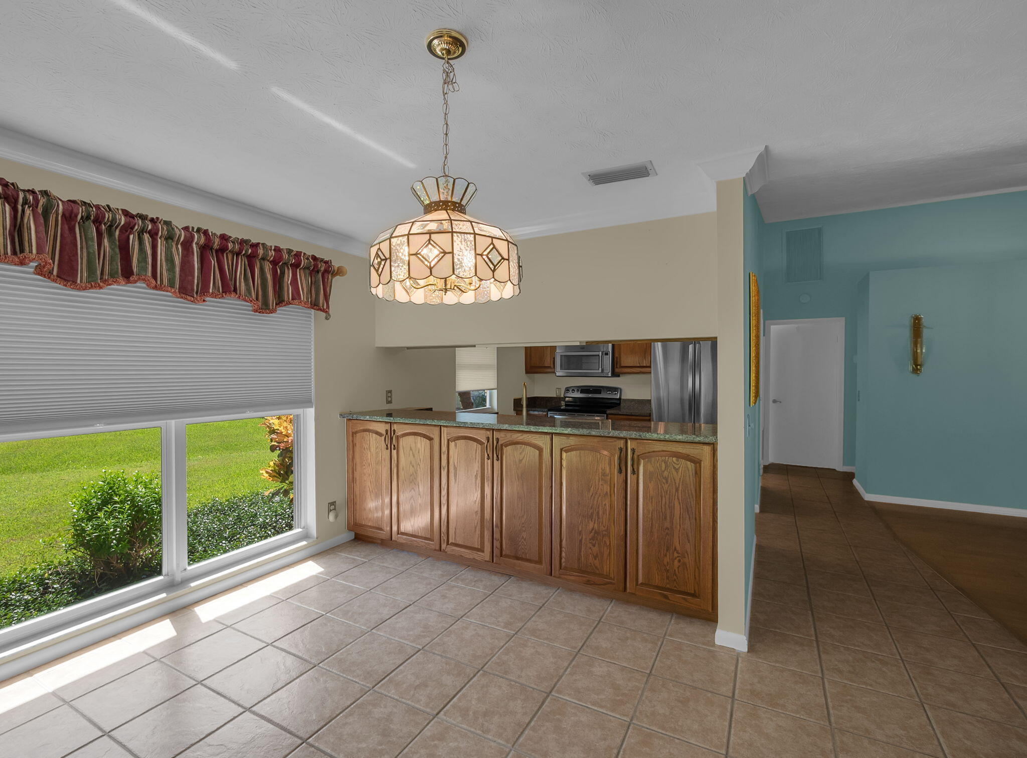 8165 Southeast Cypress Point Place Hobe Sound, FL 33455 - Photo 11 of 46 a view of kitchen with window and refrigerator