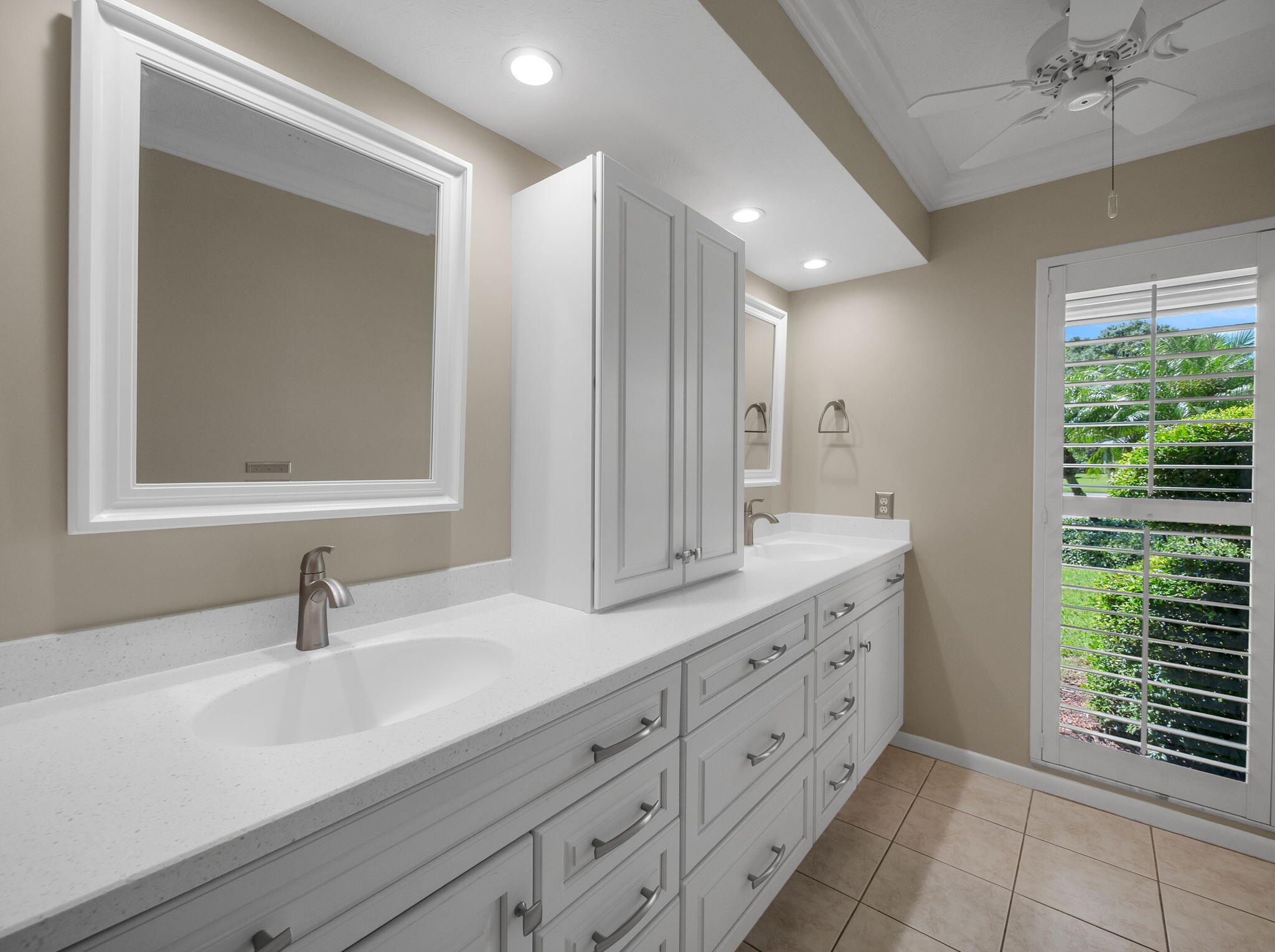 8165 Southeast Cypress Point Place Hobe Sound, FL 33455 - Photo 18 of 46 a bathroom with a sink and a mirror