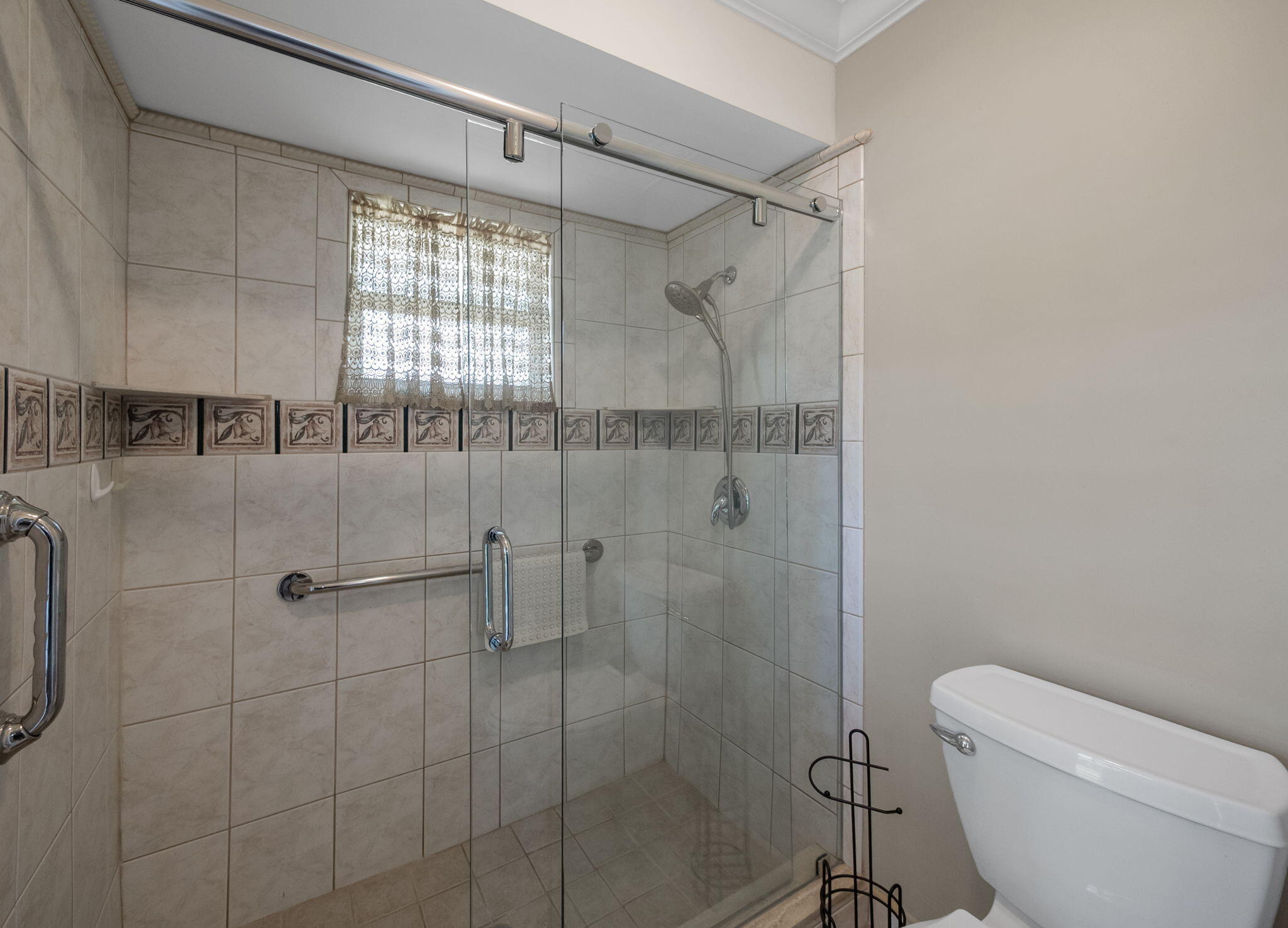 8165 Southeast Cypress Point Place Hobe Sound, FL 33455 - Photo 19 of 46 a bathroom with a shower toilet and sink