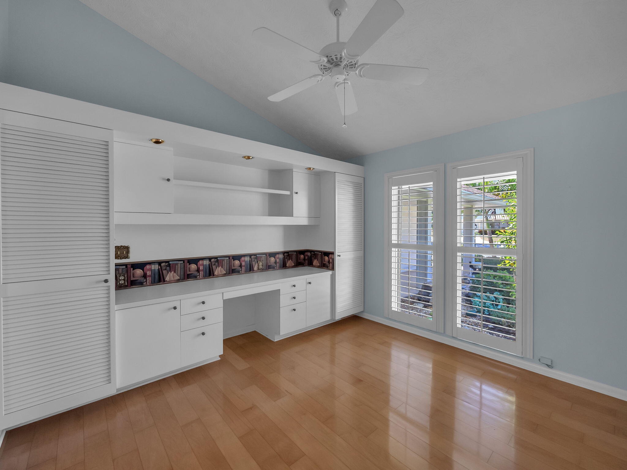 8165 Southeast Cypress Point Place Hobe Sound, FL 33455 - Photo 22 of 46 a room with furniture and window