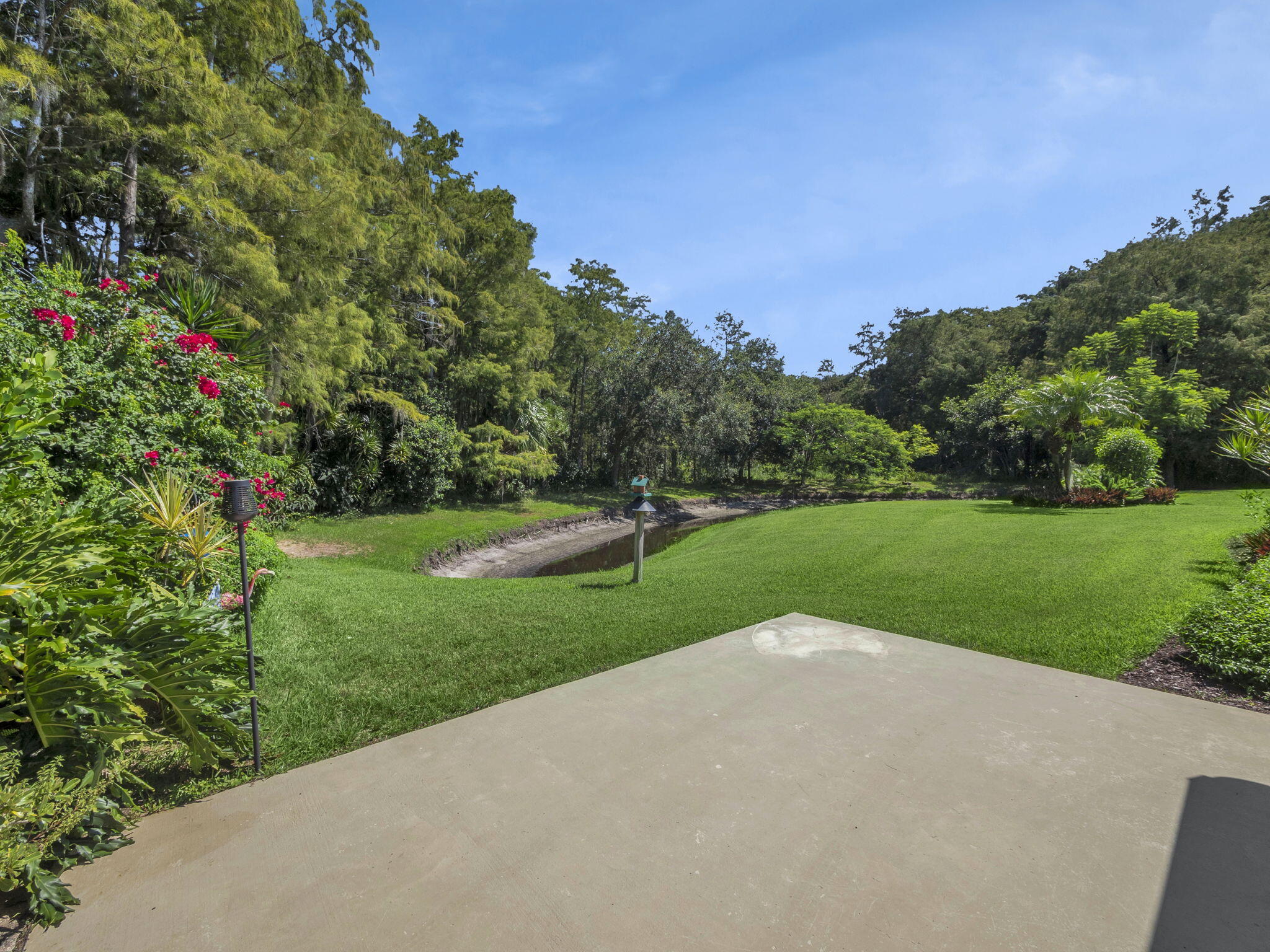 8165 Southeast Cypress Point Place Hobe Sound, FL 33455 - Photo 29 of 46 a view of outdoor space and yard