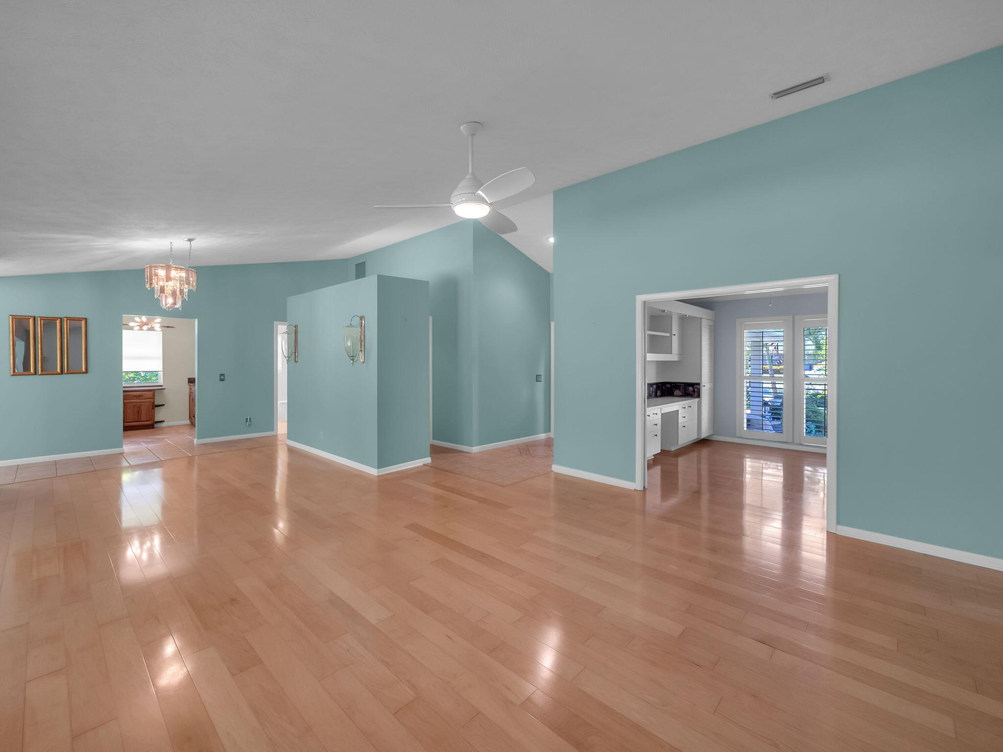 8165 Southeast Cypress Point Place Hobe Sound, FL 33455 - Photo 5 of 46 a view of livingroom and kitchen with hardwood floor