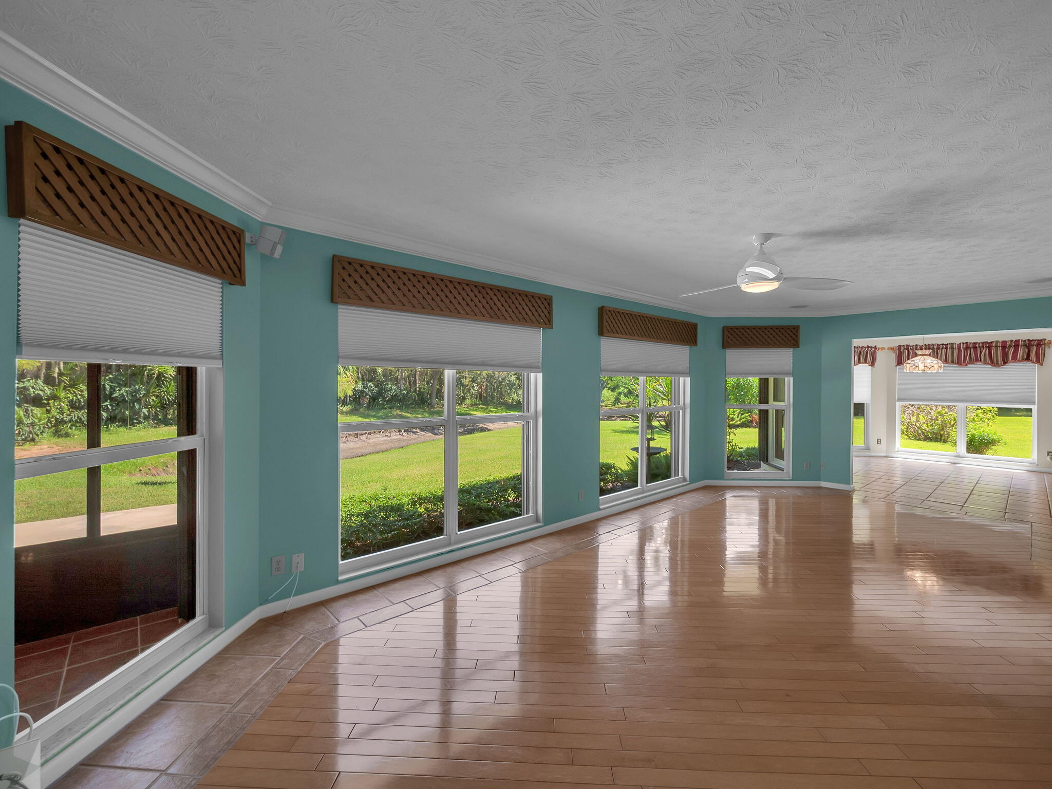 8165 Southeast Cypress Point Place Hobe Sound, FL 33455 - Photo 7 of 46 a view of an entryway with wooden floor and garden