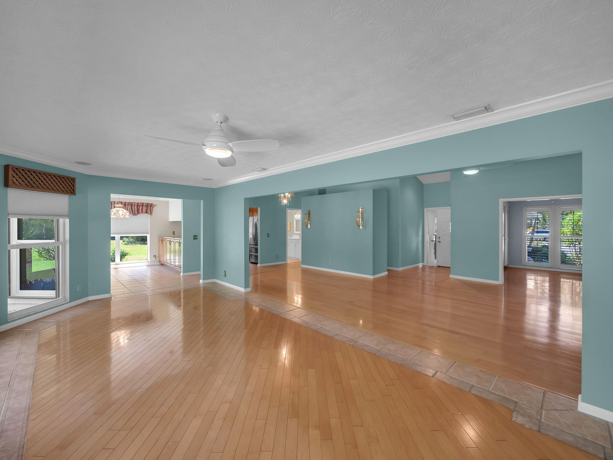 8165 Southeast Cypress Point Place Hobe Sound, FL 33455 - Photo 8 of 46 a view of an empty room with window and wooden floor