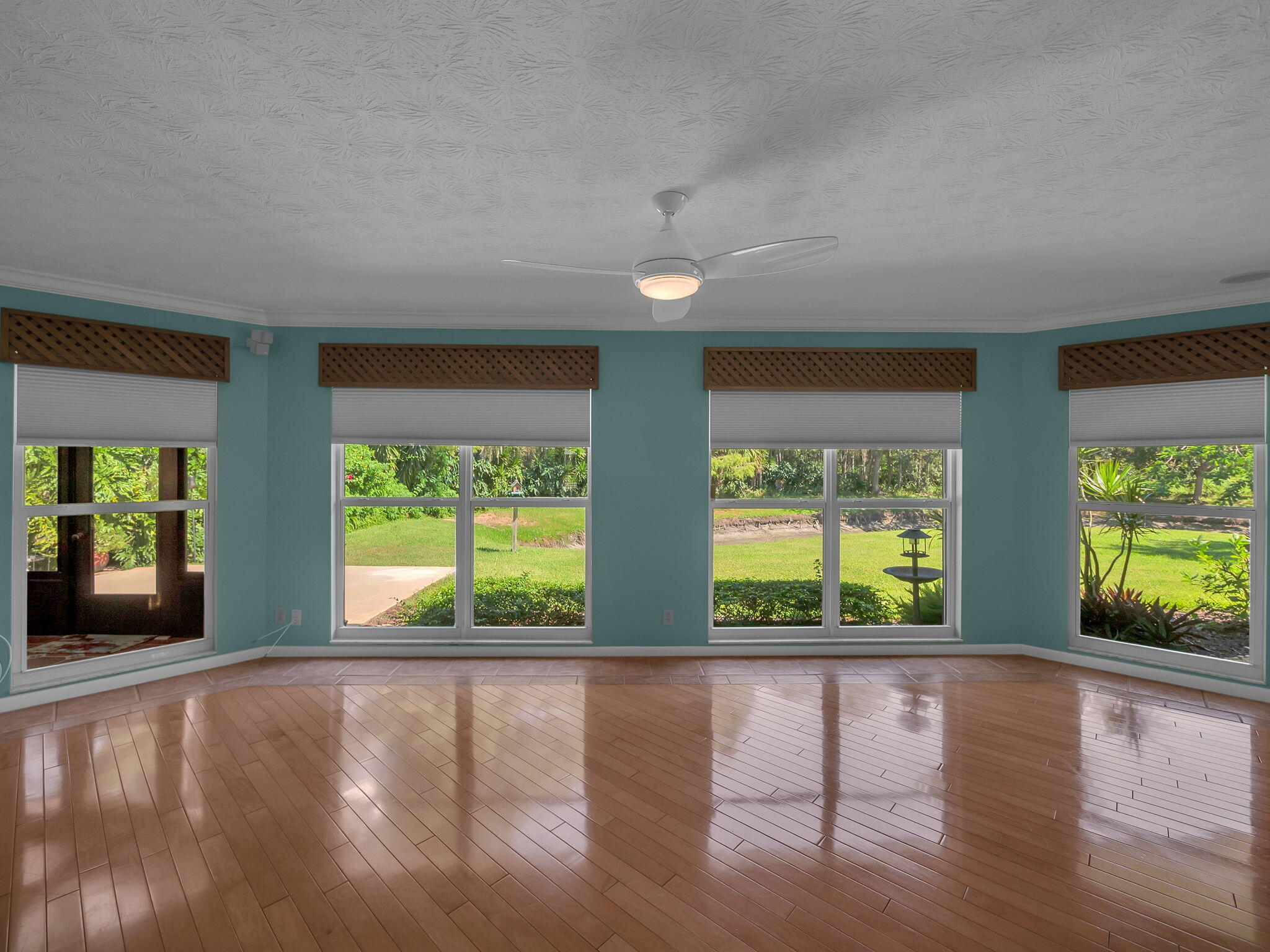 8165 Southeast Cypress Point Place Hobe Sound, FL 33455 - Photo 10 of 46 a view of an entryway with wooden floor