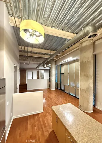 a view of an empty room with a chandelier