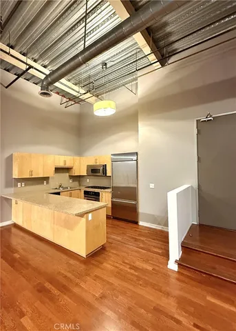 a bathroom with a sink mirror and shower