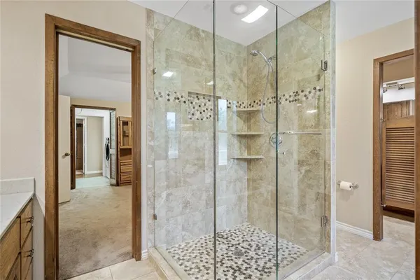 a living room filled with furniture and a large window